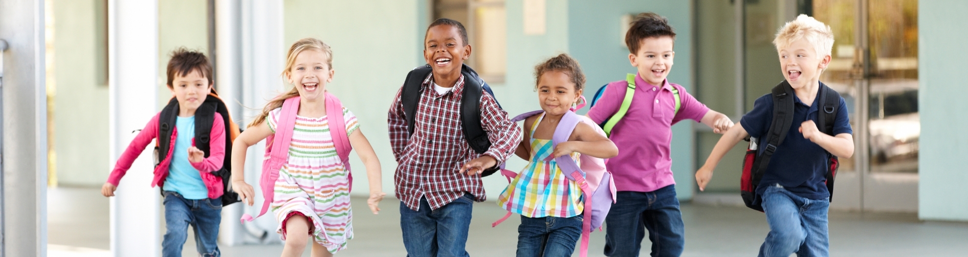 Young Kids Running At School